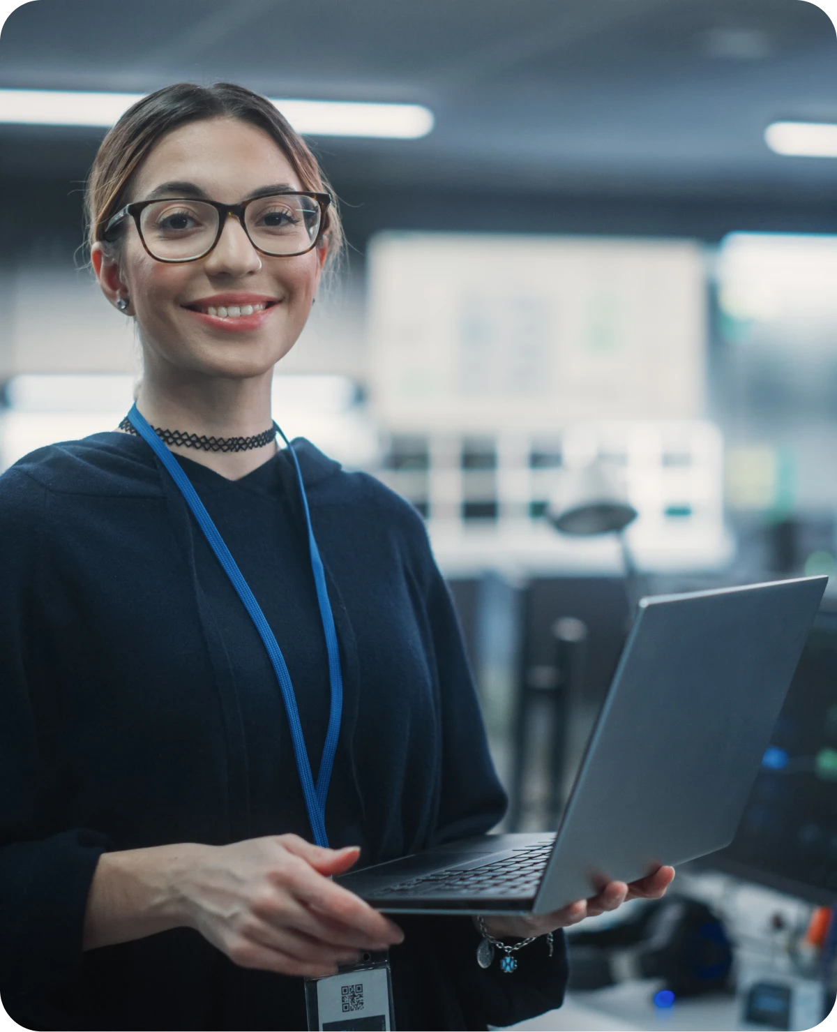Smiling woman with glasses and laptop